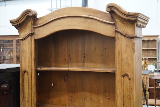 An 18th century style French provincial pine open bookcase, length 116cm, depth 28cm, height 204cm